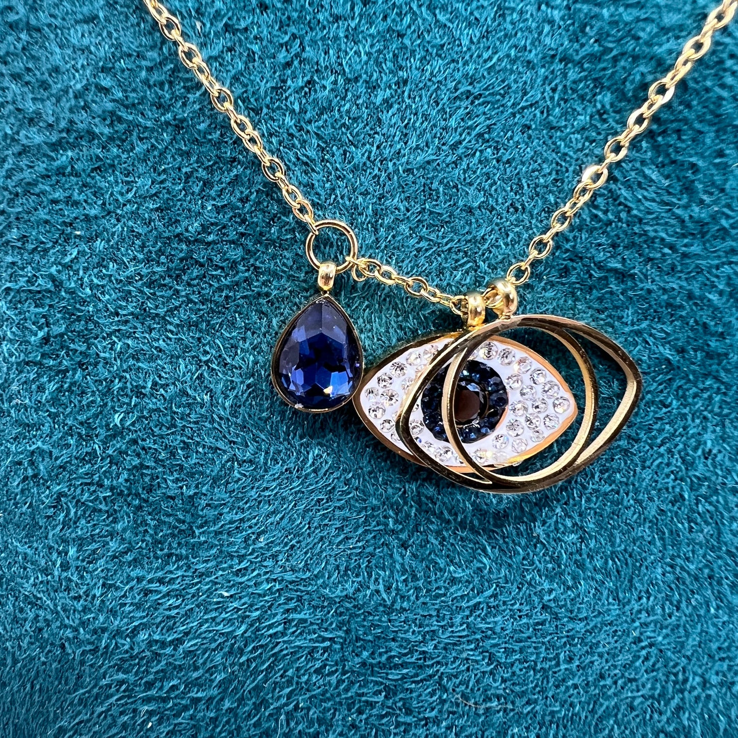 Evil eye blue stone gold necklace