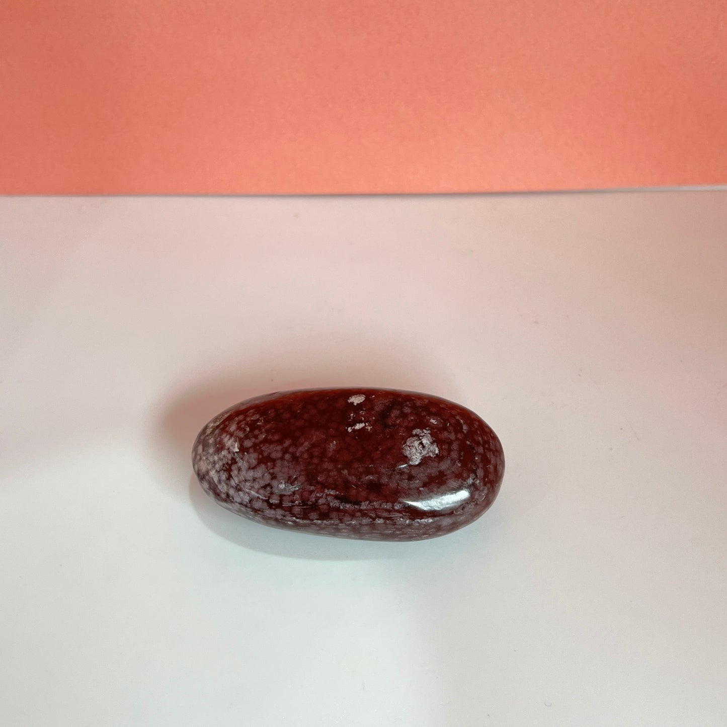 Red agate palm stone