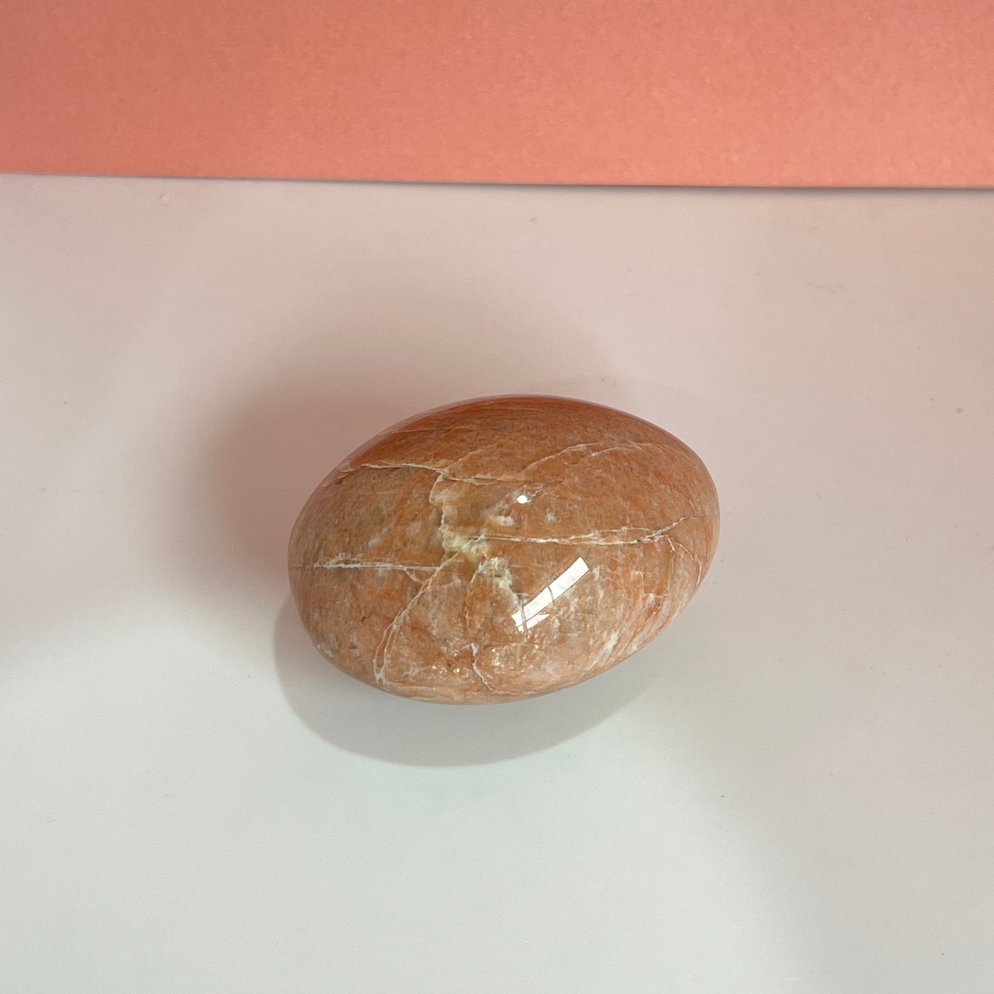 Peach moonstone palm stone